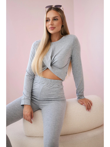 Set with ruffles on a gray blouse