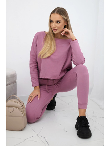 Complete with an oversized blouse in dark pink