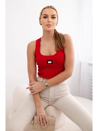 Striped blouse with red metal plate