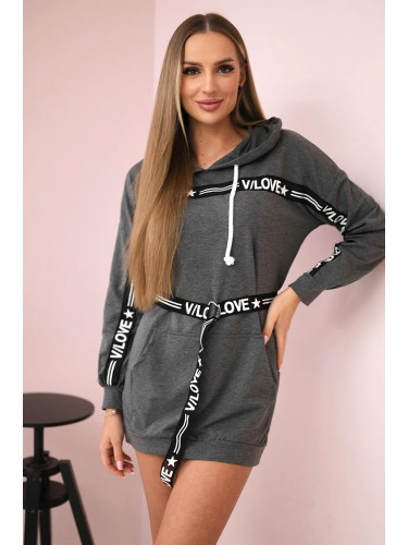 Dress decorated with a graphite slogan tape