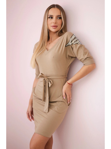 Dress with wings on camel shoulders