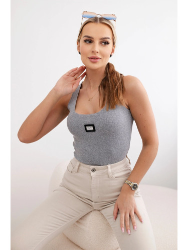 Striped blouse with a gray metal plate