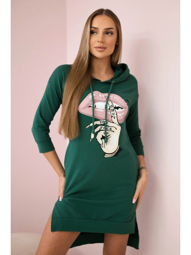 Dress with a longer back and a colorful print in dark green