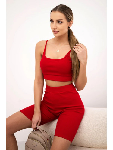 Complete with red high-waisted trousers