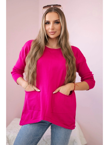 Sweater with fuchsia-colored front pockets
