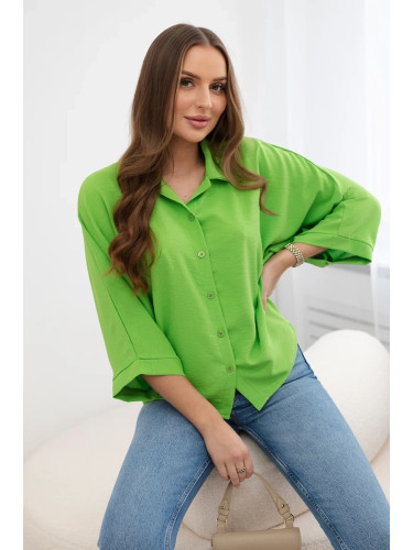 Oversized blouse with button fastenings in light green color