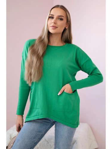 Sweater with front pockets in light green color