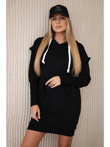 Black dress with decorative ruffles and hood