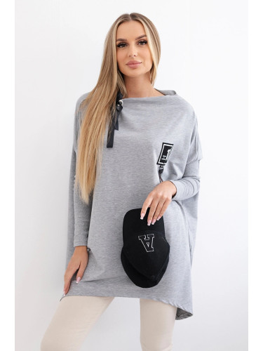 Oversize sweatshirt with asymmetrical sides in gray color