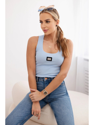 Striped blouse with blue metal plate