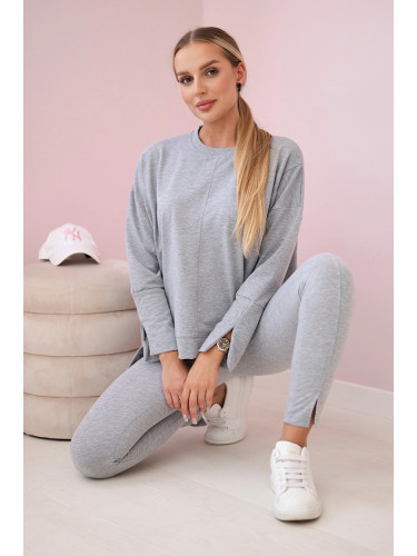 Complete with an oversized blouse in gray color