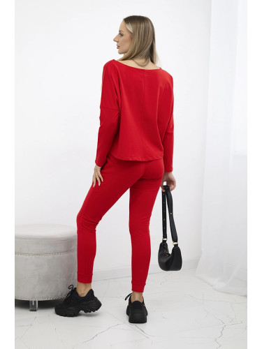 Complete with an oversized blouse in red