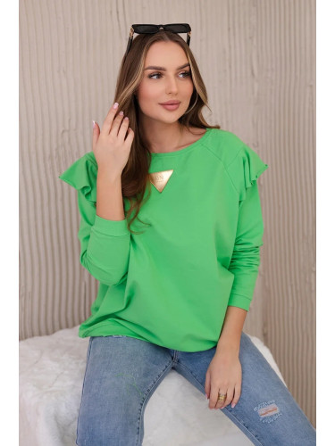Cotton blouse with ruffles on the shoulders in light green color