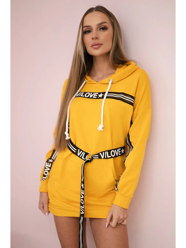 Dress decorated with a mustard inscription tape