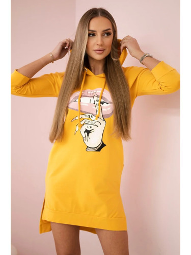 Dress with a longer back and a colorful mustard print