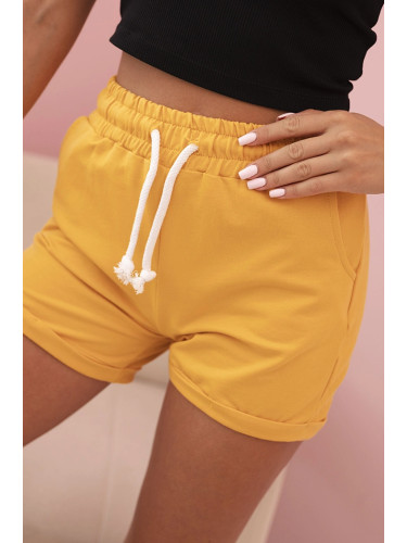 Kesi Women's cotton shorts with an elastic band and tie at the waist mustard