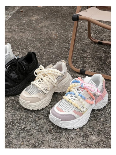 Resti Women's sporty sneakers on a thicker sole Loness