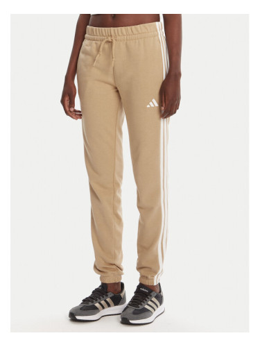 adidas Долнище анцуг Essentials 3-Stripes JX7661 Бежов Regular Fit