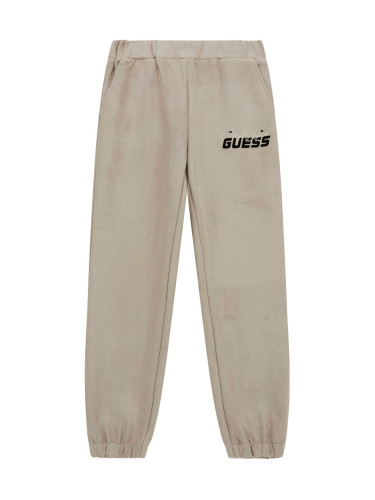 Детско долнище в бежов цвят с бродиран надпис Guess