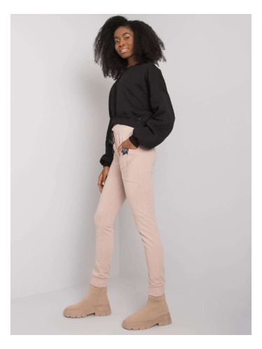 Бежови спортни панталони с джобове