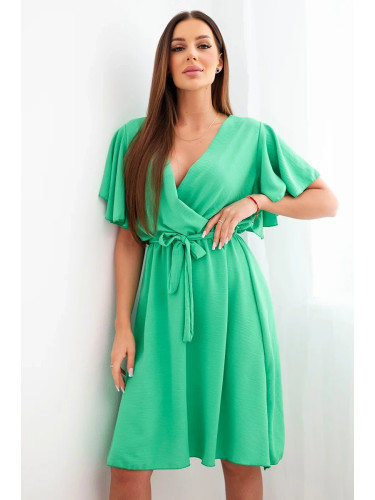 Зелена рокля с кръстосано деколте