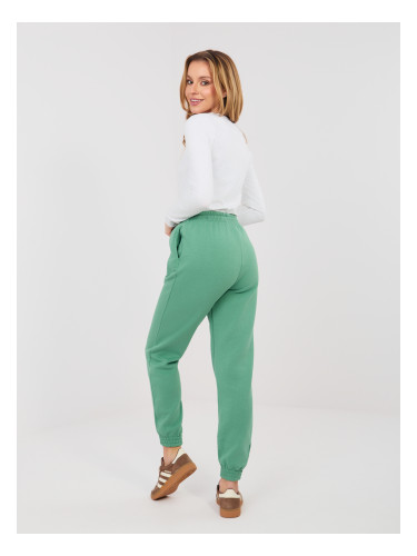 Дамски спортни панталони в цвят шамфъстък