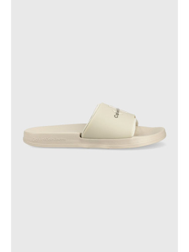 Чехли Calvin Klein Jeans SLIDE MONOGRAM TPU в бежово YM0YM00361