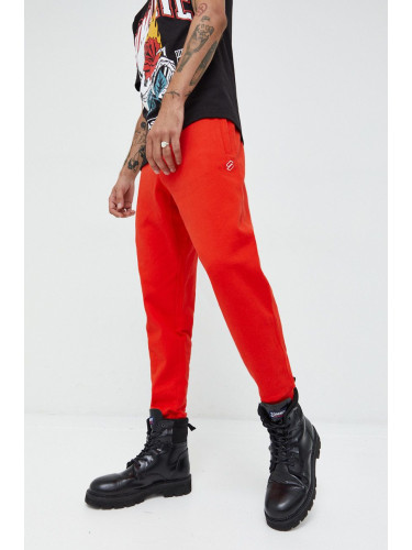 Памучен спортен панталон Superdry в червено с изчистен дизайн