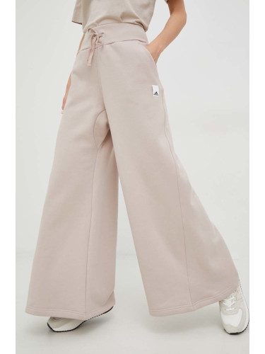 Панталони adidas в розово с изчистен дизайн