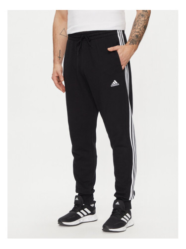 adidas Долнище анцуг Essentials French Terry Tapered Cuff 3-Stripes Joggers HA4337 Черен Regular Fit