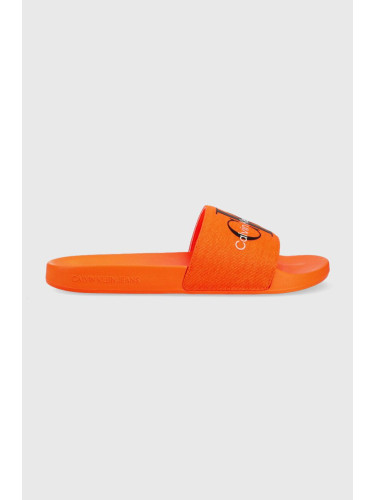 Чехли Calvin Klein Jeans SLIDE MONOGRAM CO в оранжево YM0YM00061