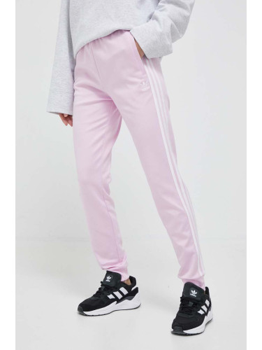 Спортен панталон adidas Originals в розово с апликация