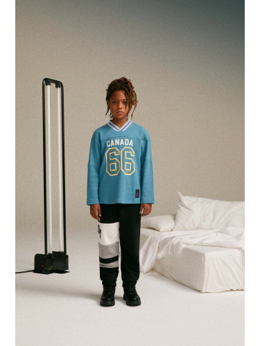 Детски памучен спортен панталон Sisley в черно с десен