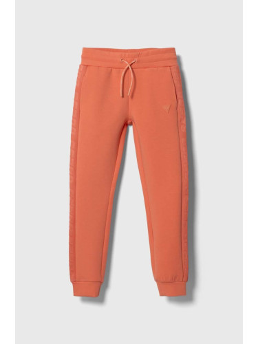 Детски спортен панталон Guess в оранжево с изчистен дизайн