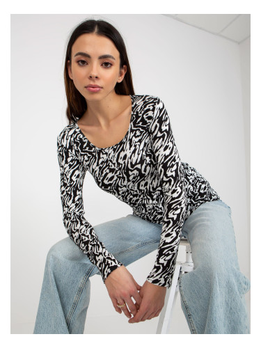 Black and white fitted blouse with patterns