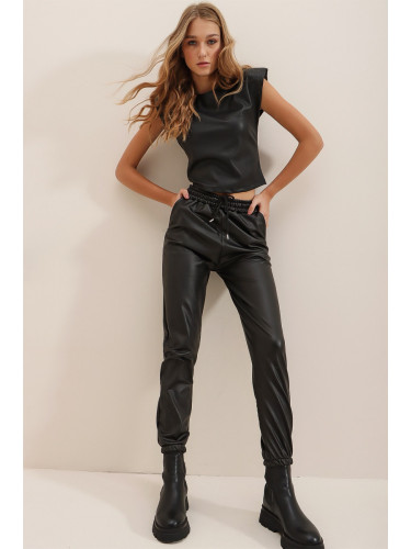 Тенденция Alaçatı Stili Дамски черен двоен джоб ластик и глезени, повдигнат вътрешен блендер ежедневни панталони от изкуствена кожа