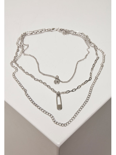 Layered necklace with a silver-colored amulet