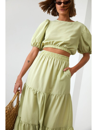 Lady's summer set blouse with a skirt in light khaki color