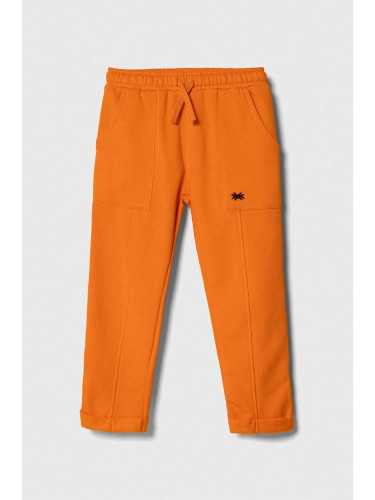 Детски спортен панталон United Colors of Benetton в оранжево с изчистен дизайн
