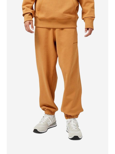 Памучен спортен панталон New Balance в оранжево с изчистен дизайн