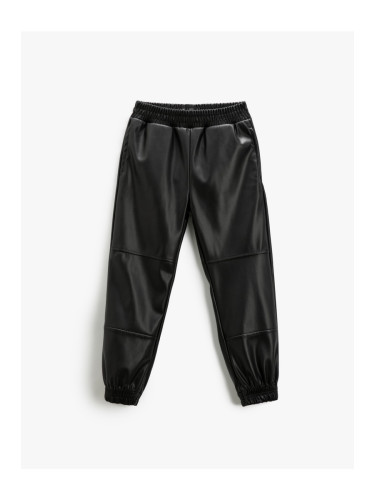 Koton Leather Look Jogger Pants with Elastic Waist and Pockets.