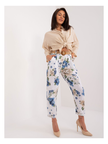 White women's fabric trousers with flowers