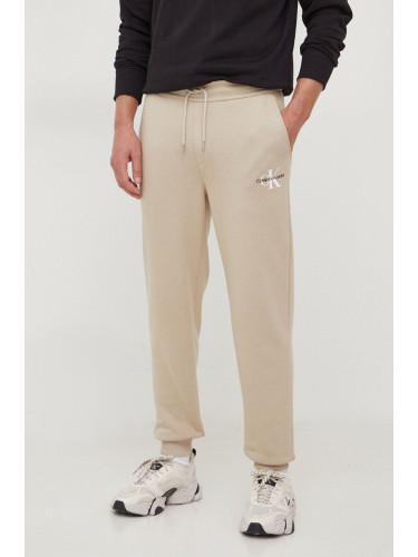 Спортен панталон Calvin Klein Jeans в бежово с принт J30J324685