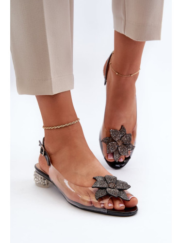 Transparent low-heeled sandals with black D&A embellishment