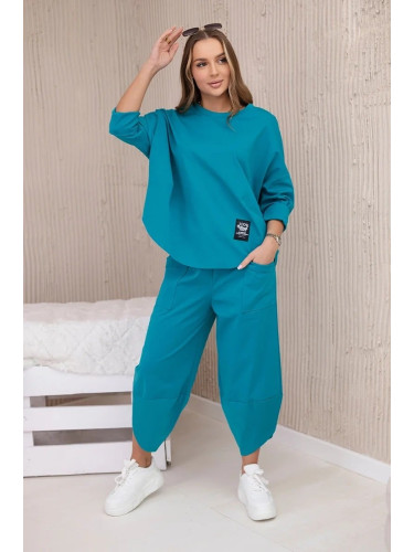 Loose women's set of trousers and blue-green sweatshirt
