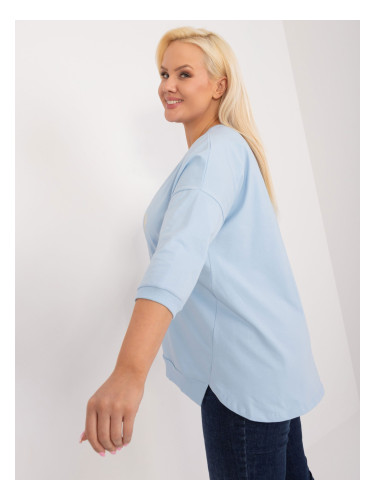 A light blue plus-size blouse with slits