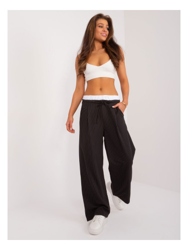 Black wide trousers with a contrasting belt