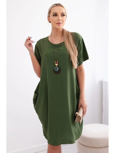 Loose dress with pockets and a pendant, light green