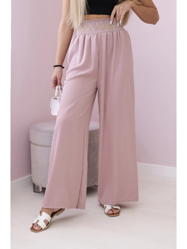 Trousers with a wide elastic waistband in dark pink colour
