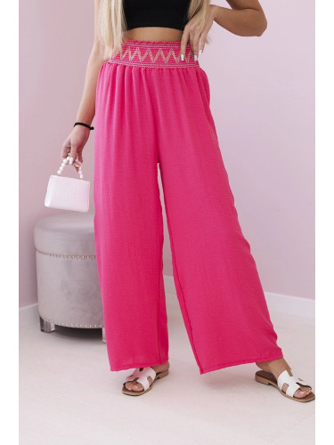 Trousers with a wide elastic waistband in pink color